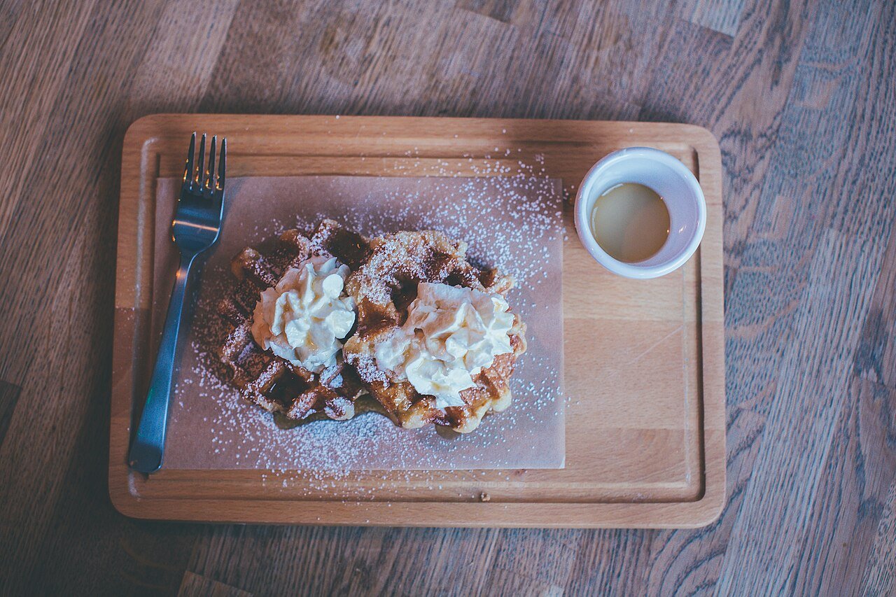 Waffles and coffee shared around a table in Oslo